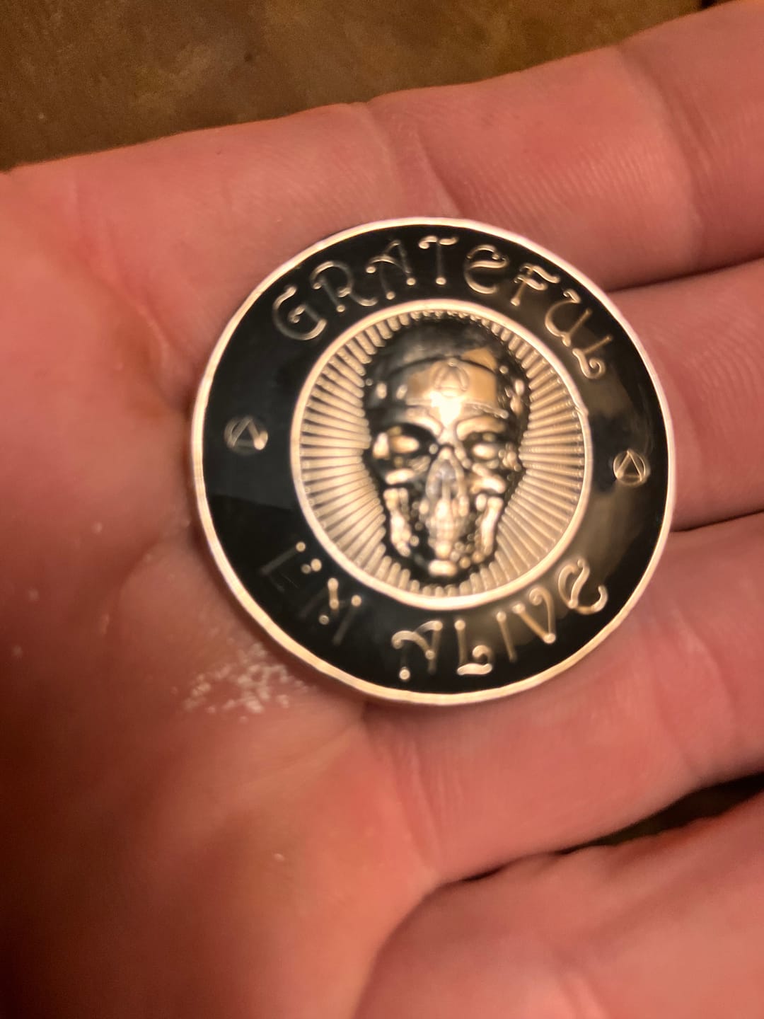 Customer photo review of Grateful I'm Alive AA/NA 3D Sculpted Affirmation Recovery Medallion - Black / Silver