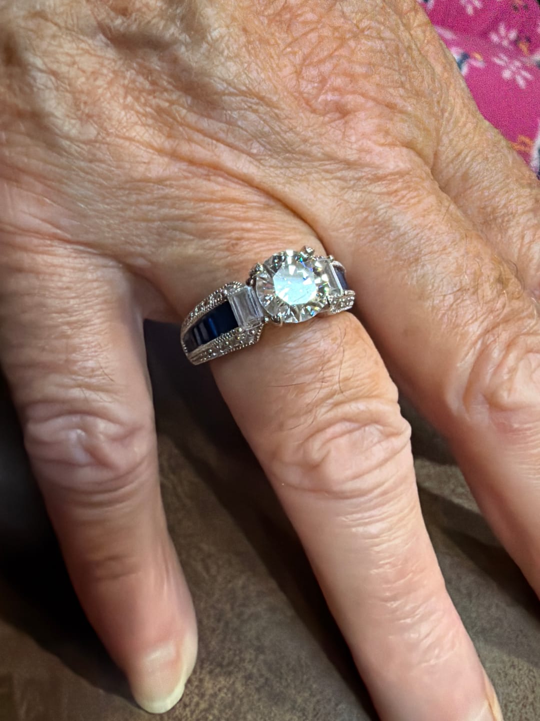Customer photo review of Round Moissanite And Emerald-Cut Sapphire Channel Set Milgrain Engagement Ring