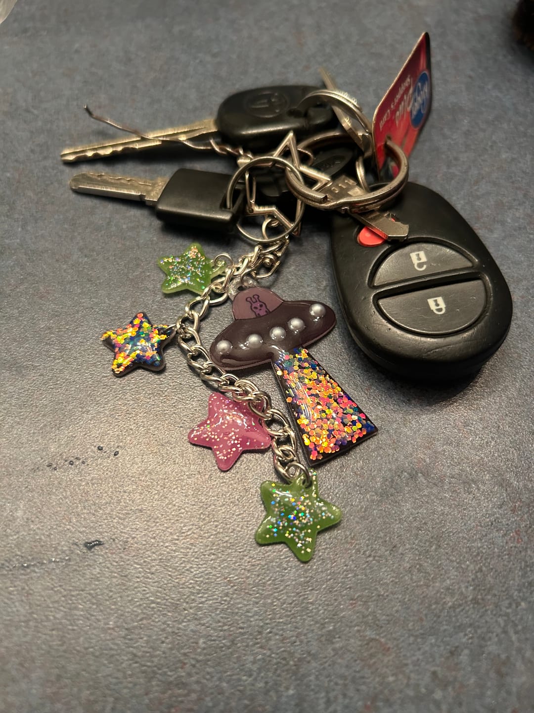 Customer photo review of Cosmic Orchid UFO keychain
