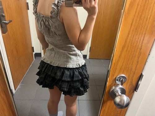 Customer photo review of Madeleine Noir Dark Plaid Flare Layered Skort