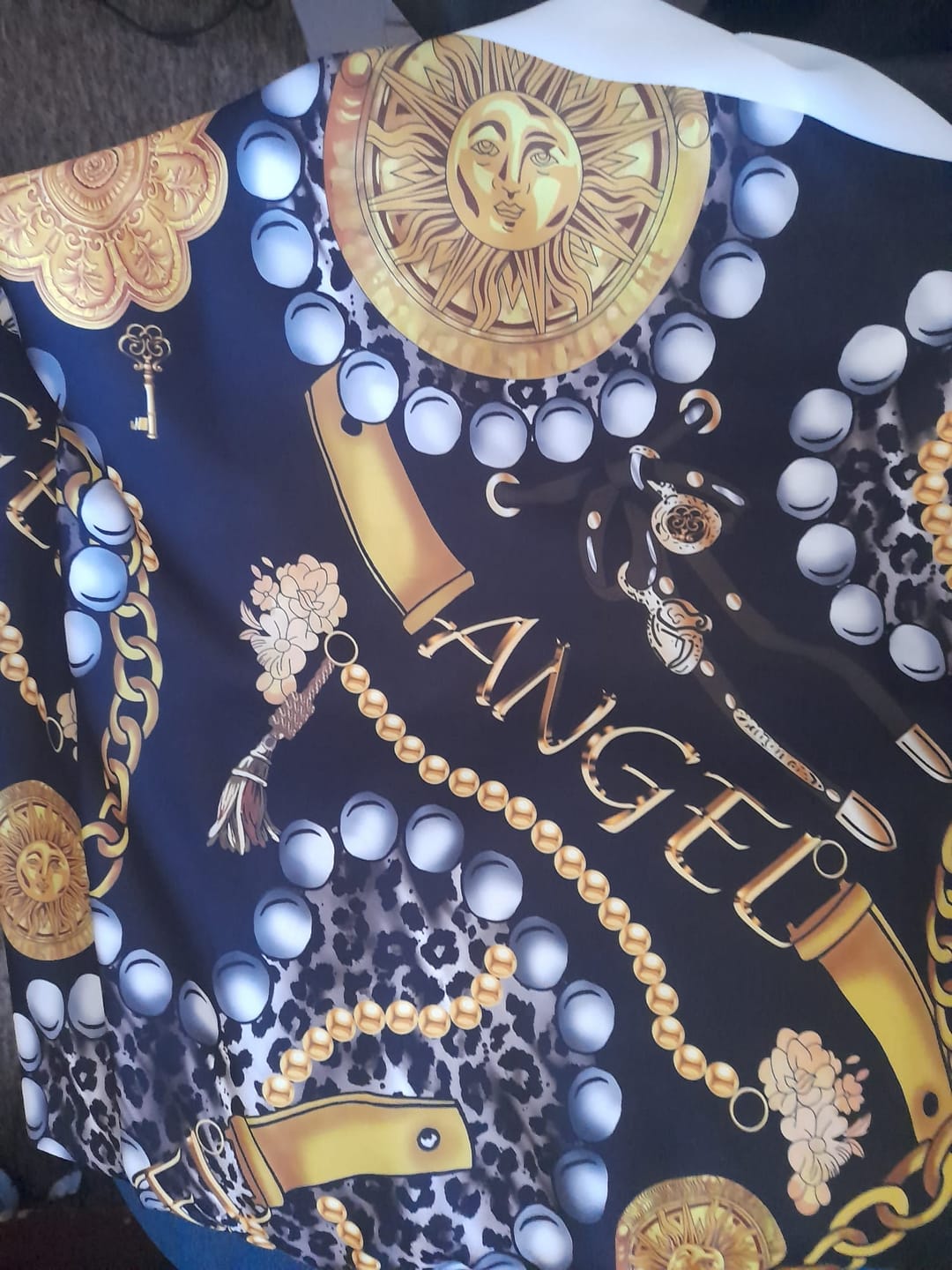 Customer photo review of Gold Chain, Leopard, and Pearl Print on Black Background Fabric by the Metre