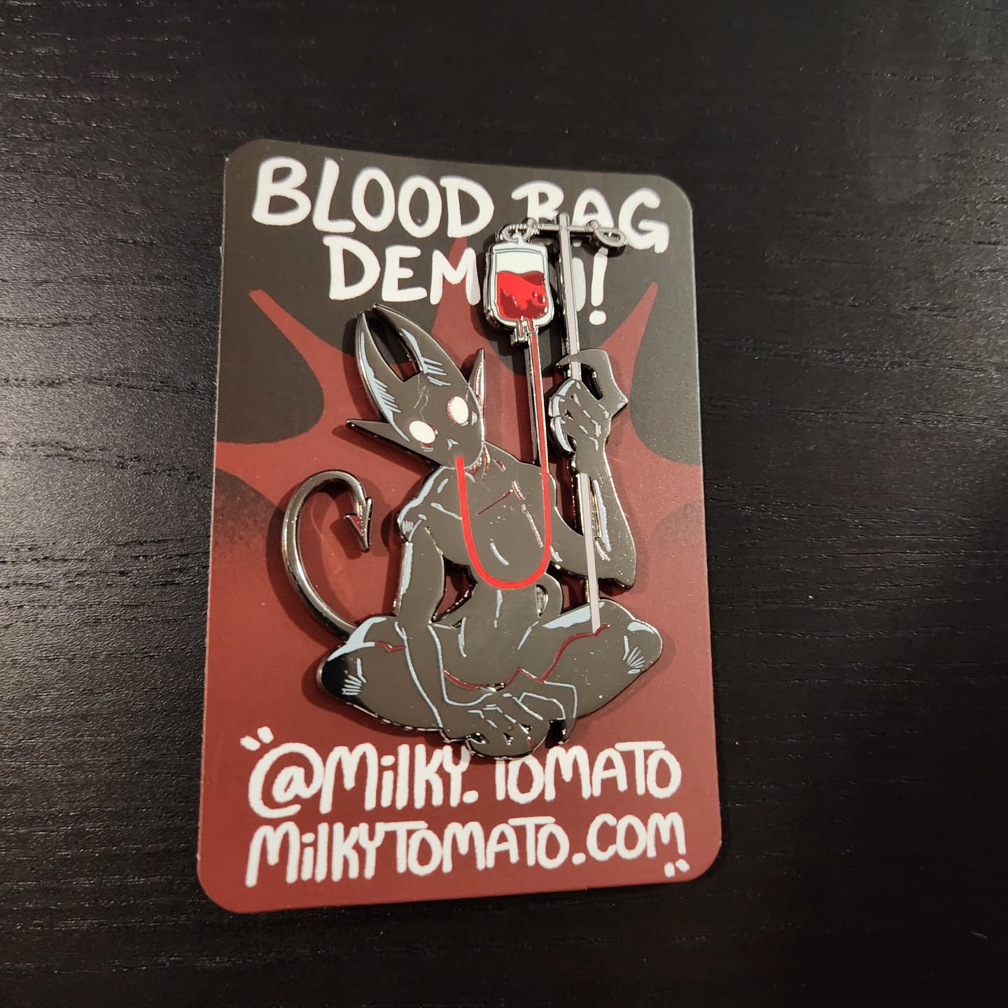 Customer photo review of Blood Bag Demon Enamel Pin
