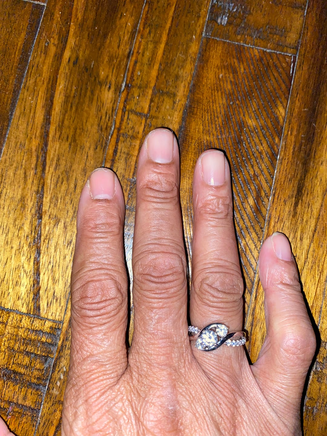 Customer photo review of Swirl Three Stone Moissanite Twisted Pave Engagement Ring
