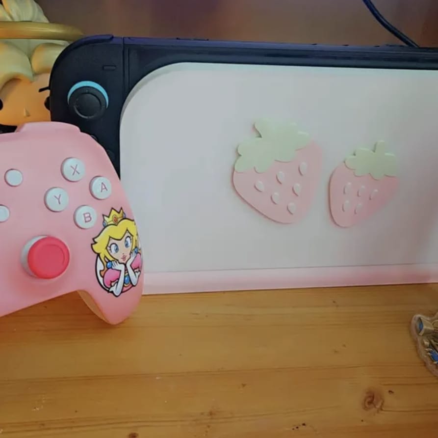 Customer photo review of Strawberry Dock Cover for Nintendo Switch 2 – Original Faceplate Design