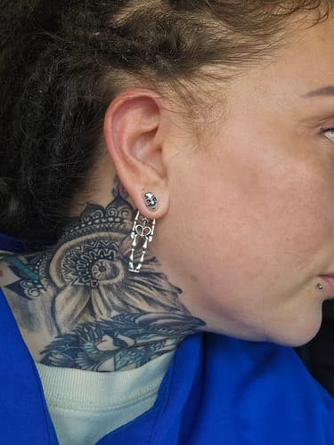 Customer photo review of Hanging Skeleton Earrings