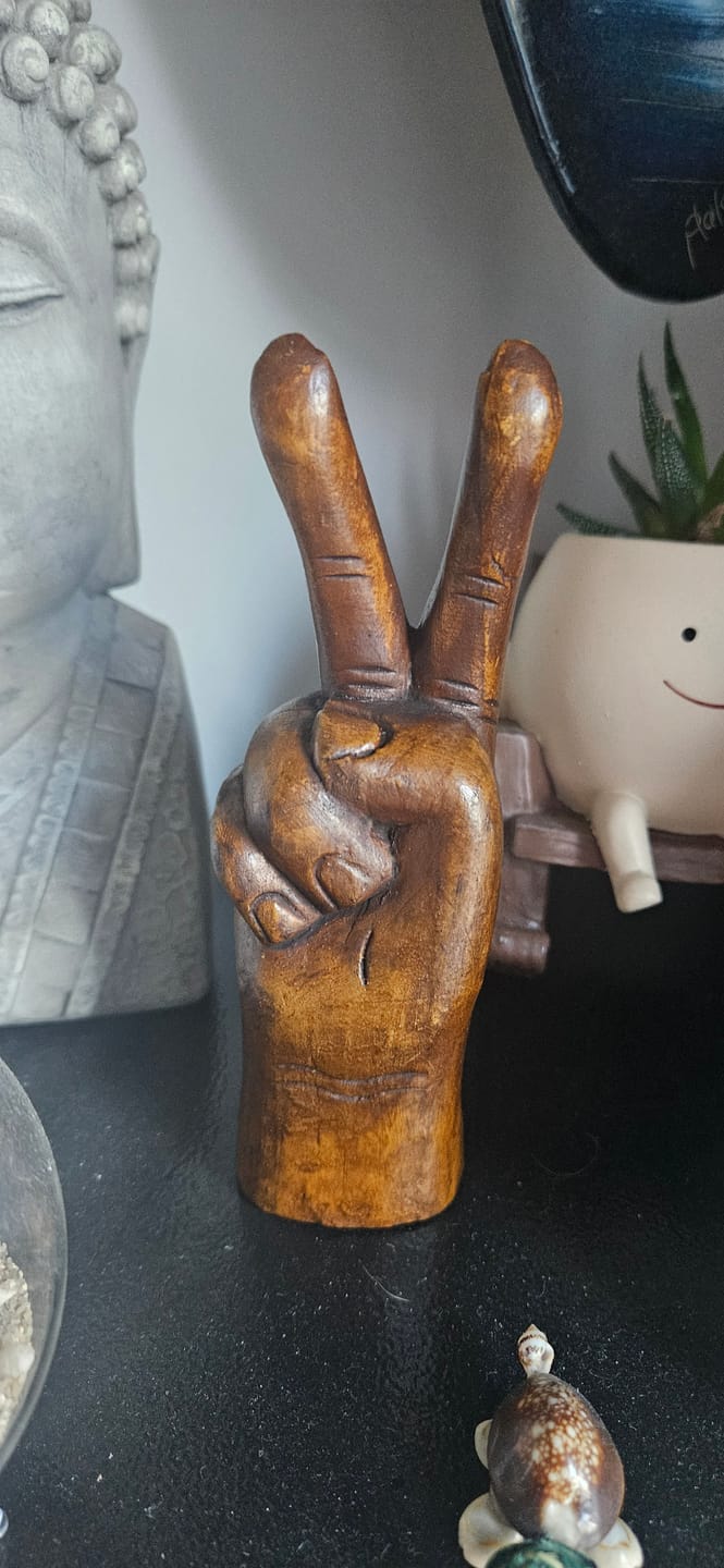 Customer photo review of Keep the Peace Wooden Mini Statue