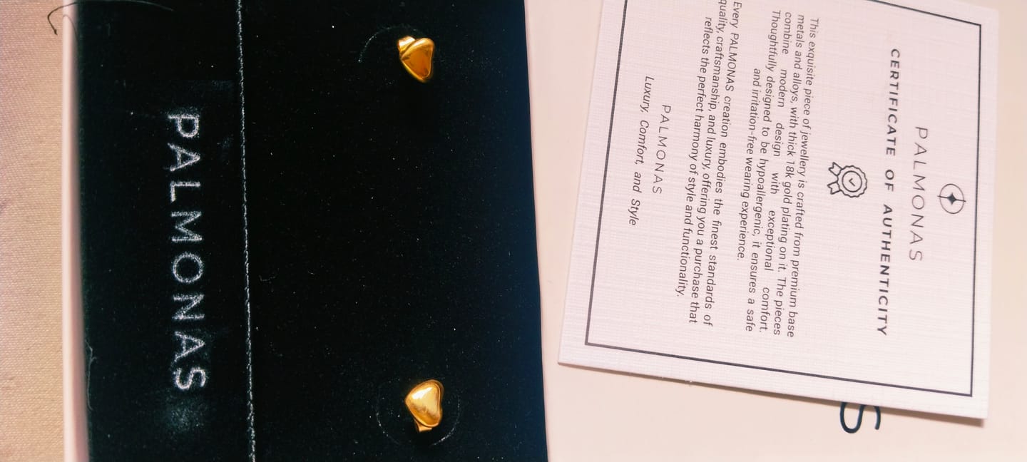 Customer photo review of Minimalist Heart Stud Earrings