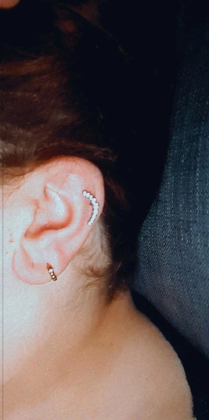 Customer photo review of Bright Bow Piercing | Titan