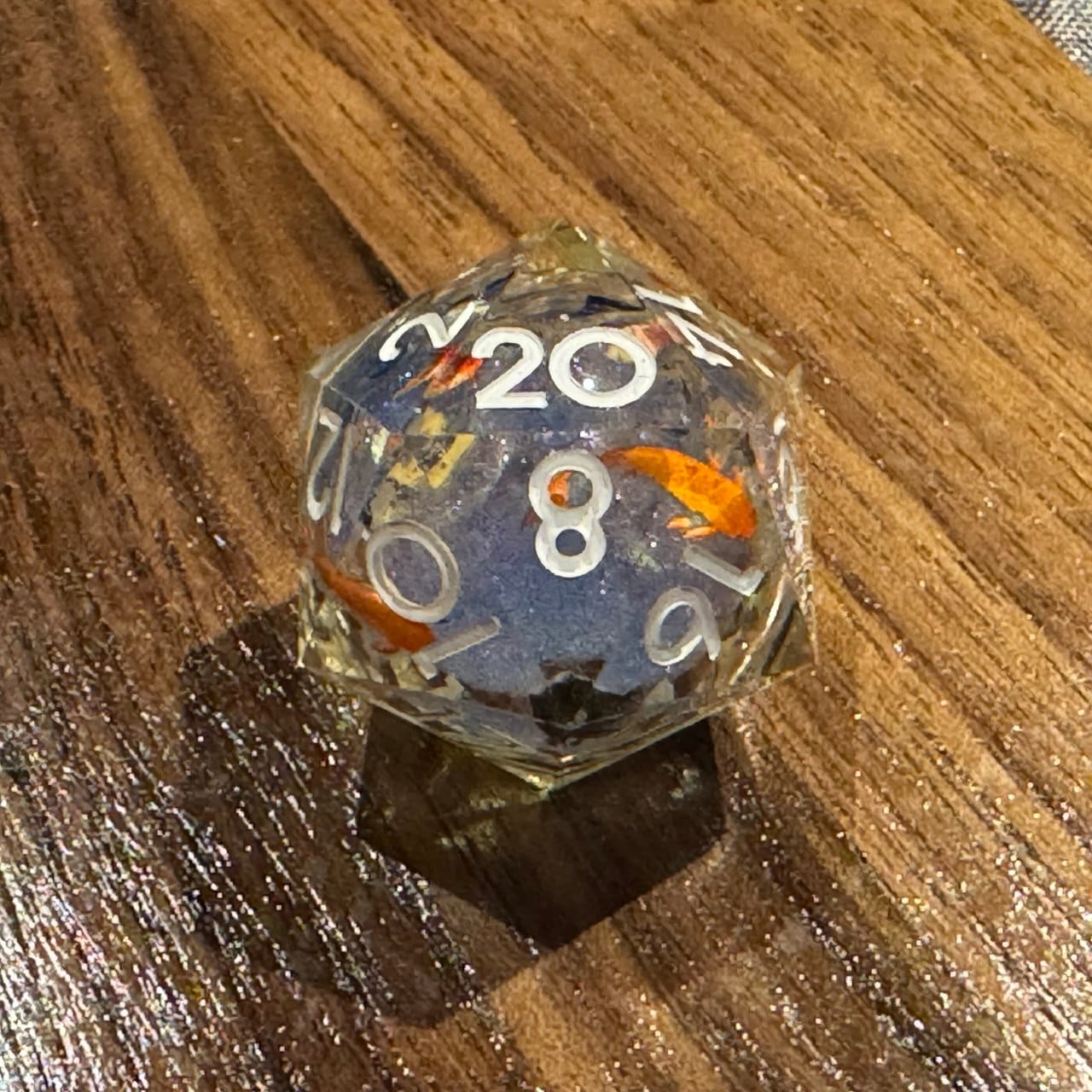 Customer photo review of URWizards D&D Starry Liquid Heart Resin Engraved Dice Set Koi Fish