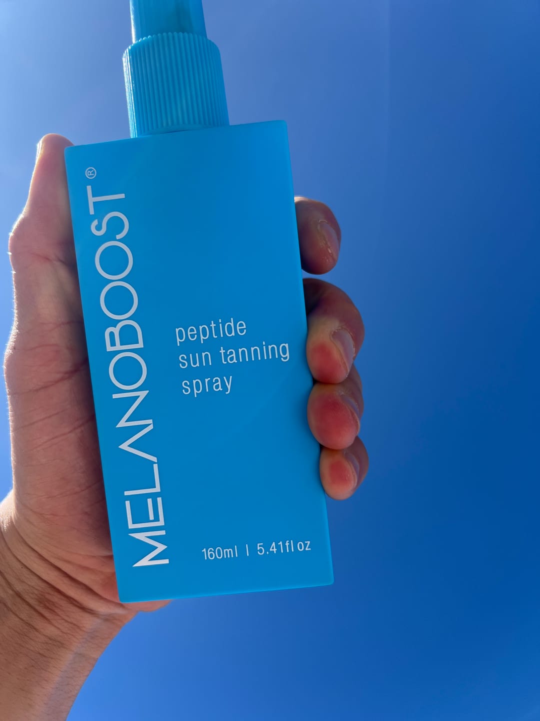 Customer photo review of Melanoboost Peptide Sun Tanning Spray