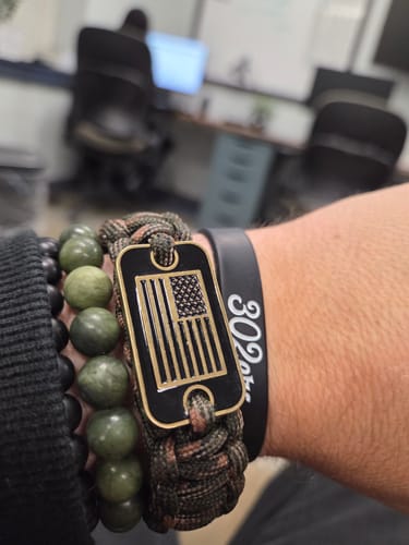 Customer photo review of Camo Paracord Bronze Flag Bracelet- Helps Pair Veterans With A Companion Dog