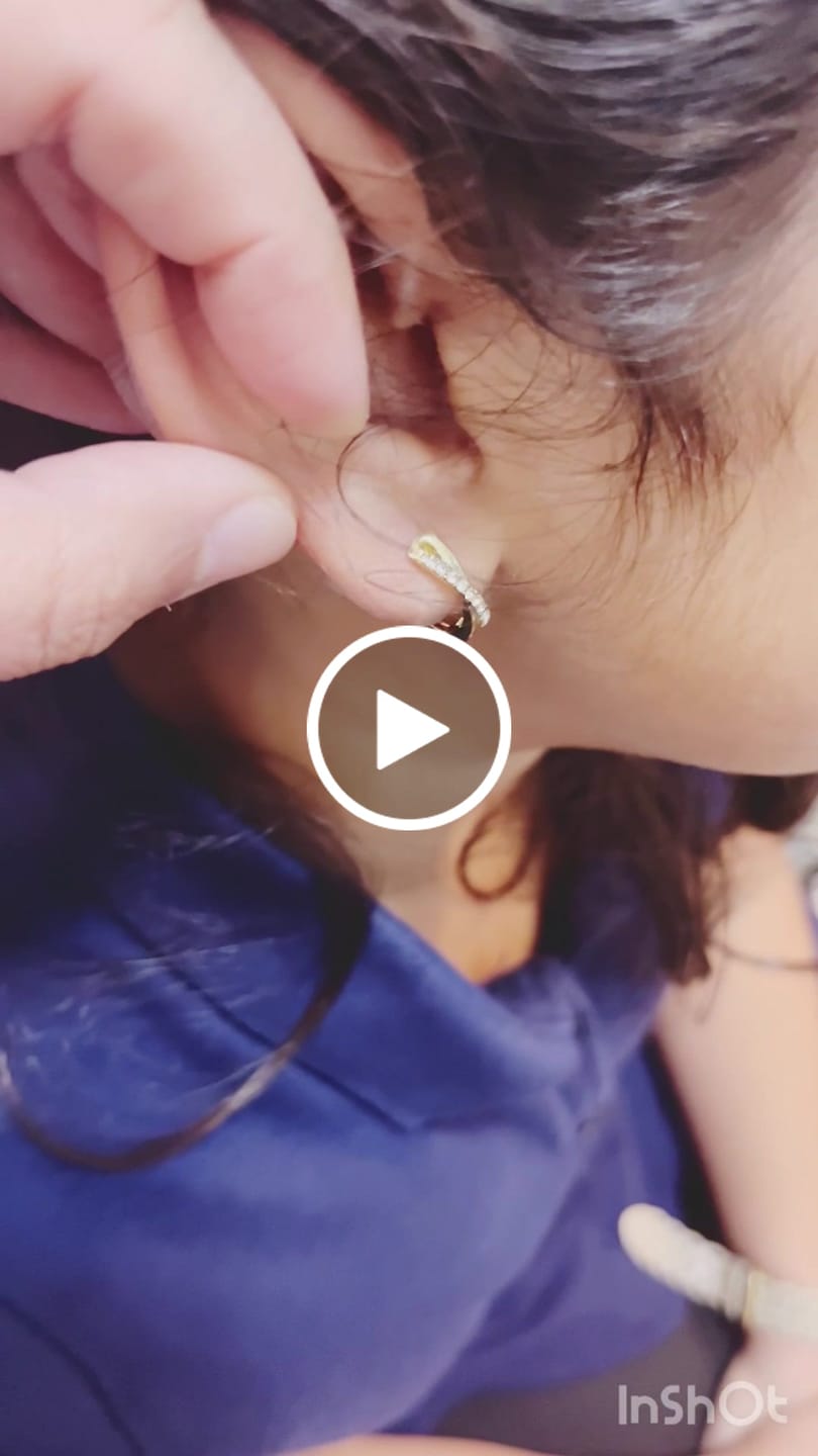 Customer video review of Amaya 18k White Gold Plated 16mm Twisted Hoop Earrings with Swarovski Crystals