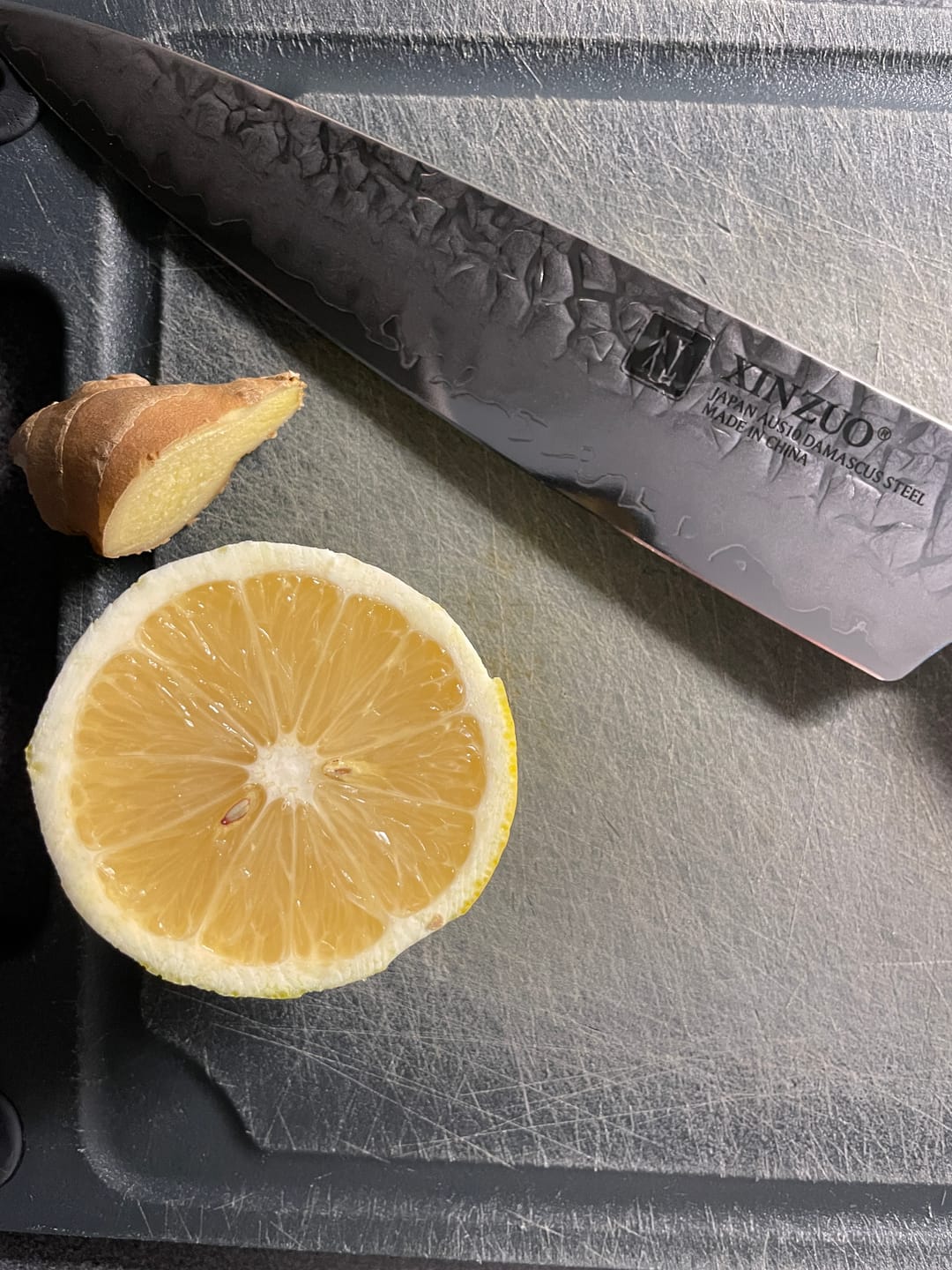 Customer photo review of XINZUO 5" (133MM) Kinomi Series Petty (Universalmesser) mit Walnussholzgriff und AUS-10 Damaststahl