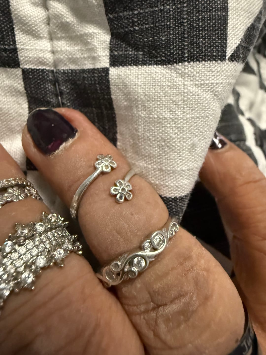 Customer photo review of Bezel Set Round Moissanite Scroll Accents Wedding Band Ring In Sterling Silver