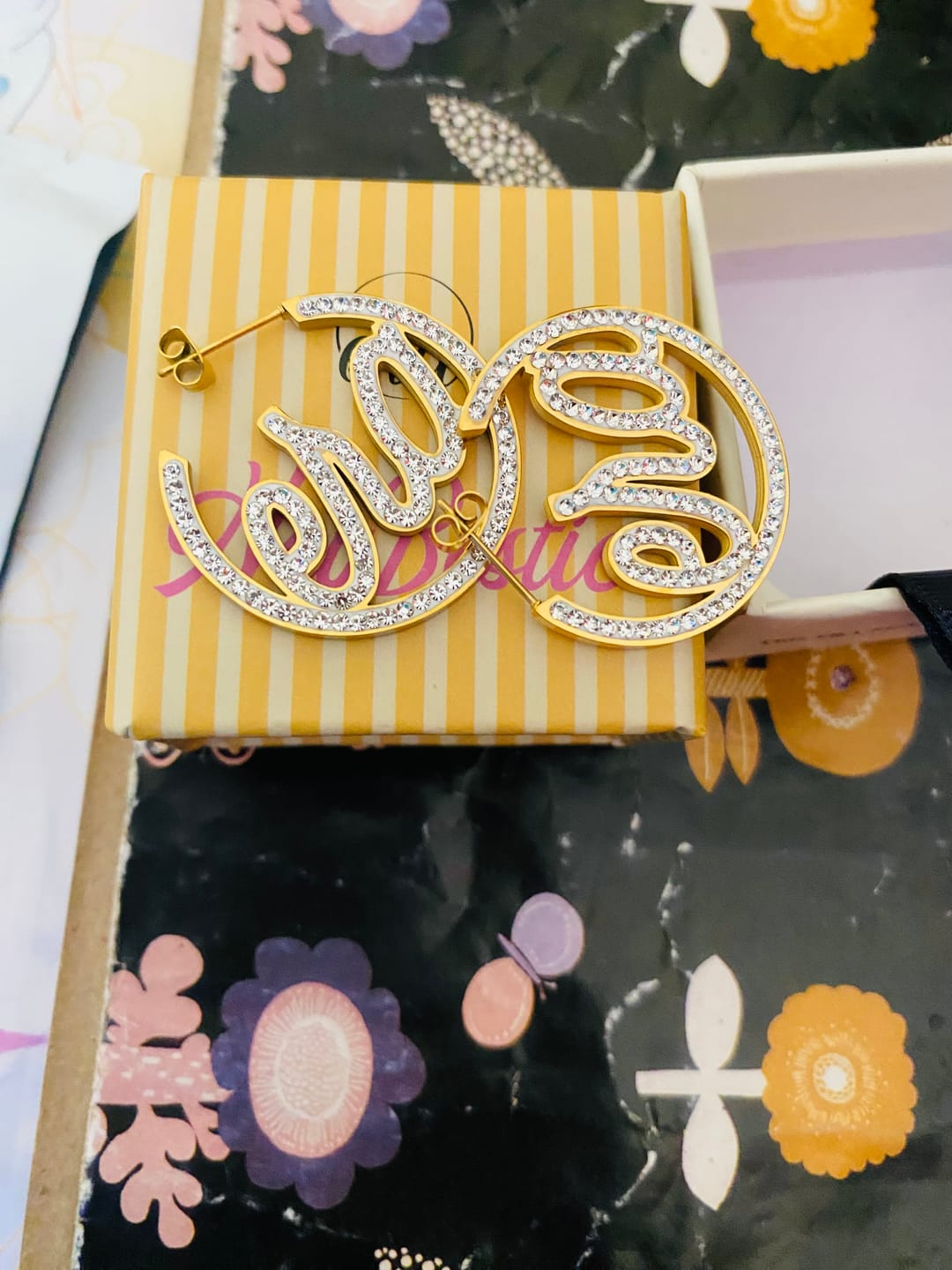 Customer photo review of Gold Luxe Mini Logo Hoops