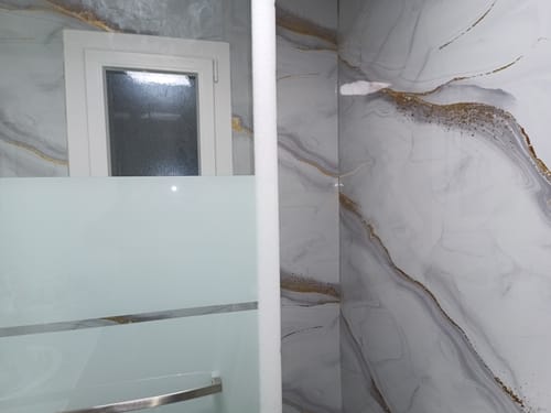 Customer photo review of Panneau Mural PVC Effet Marbre Doré – Étanche et facile à poser