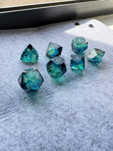 Customer photo review of URWizards D&D Resin Tidebound Fate Engraved Dice Set Multi-faceted Style