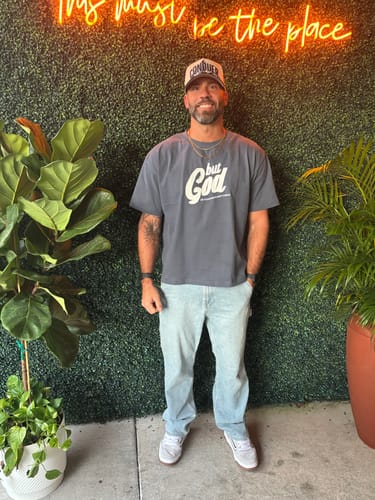 Customer photo review of But God Premium Hand-Stitched Tee