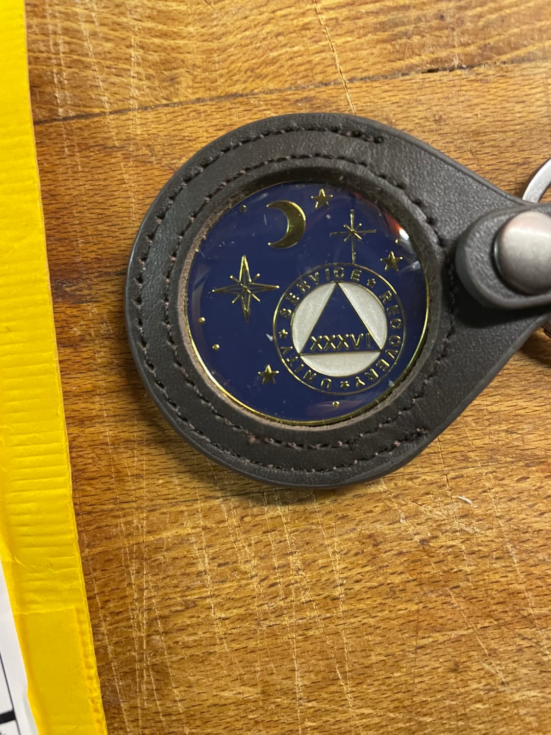 Customer photo review of Sobriety Mint Genuine Leather 40mm AA Medallion Keychain Holder - Recovery Chip/Coin/Token Holder - Black
