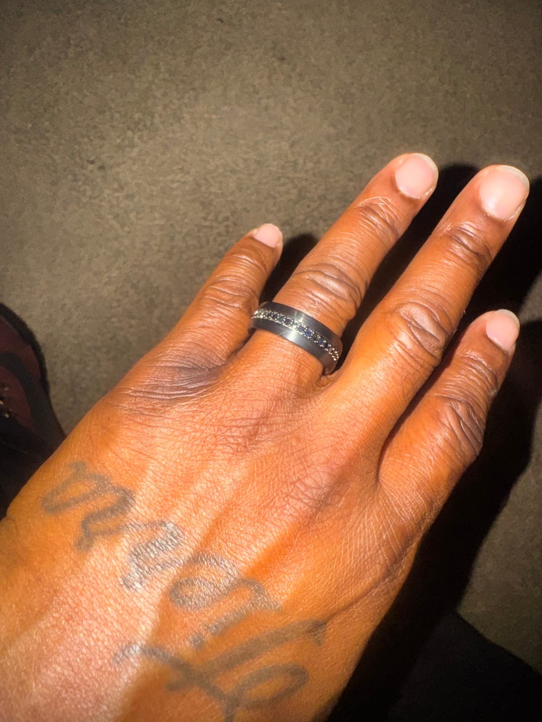 Customer photo review of 8mm - Black Tungsten Hammered Wedding Band, with Black Sapphires Stepped Edges