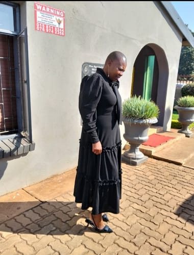 Nkhensani M. review of Ribbon Design Round Neck Puff Shoulder Pleat Midi Dress image 1 out of 1