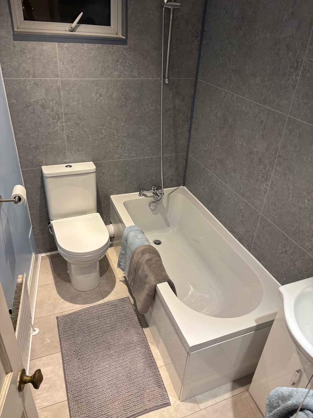 Customer photo review of 10mm Large Tile Light Concrete Matt Shower Panel 1M x 2.4M