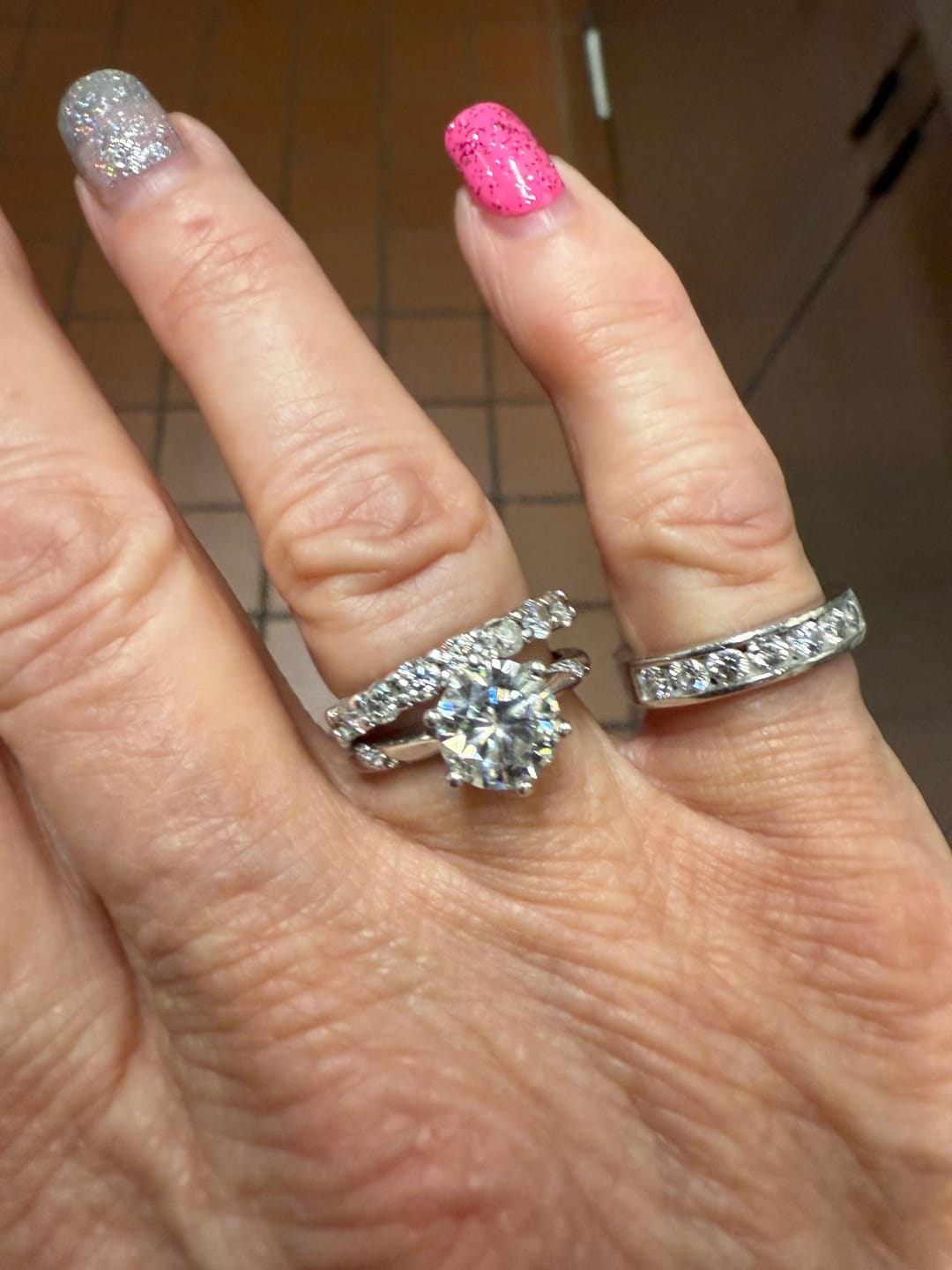 Customer photo review of Channel Set Moissanite Half Eternity Wedding Band Ring In Sterling Silver