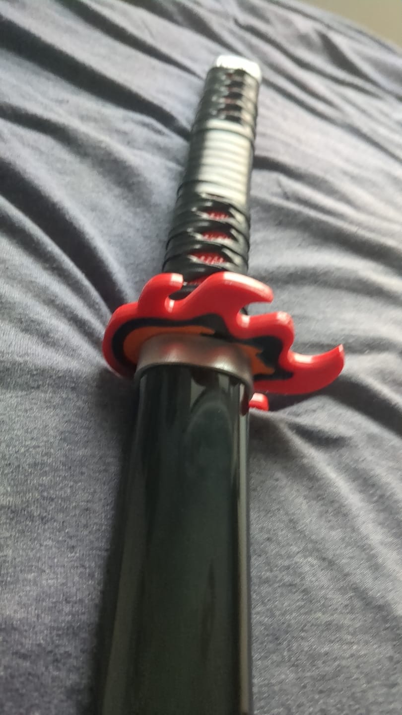 Customer photo review of Demon Slayer Sword Tanjiro Rengoku Hilt Fire Breath Wooden Bamboo Cosplay Sword