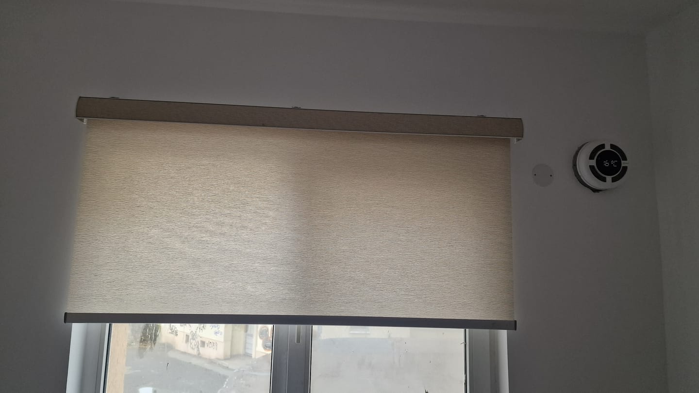 Customer photo review of SmartWings Hardwired Motorized Light Filtering Roller Shades 70% Blackout Safari