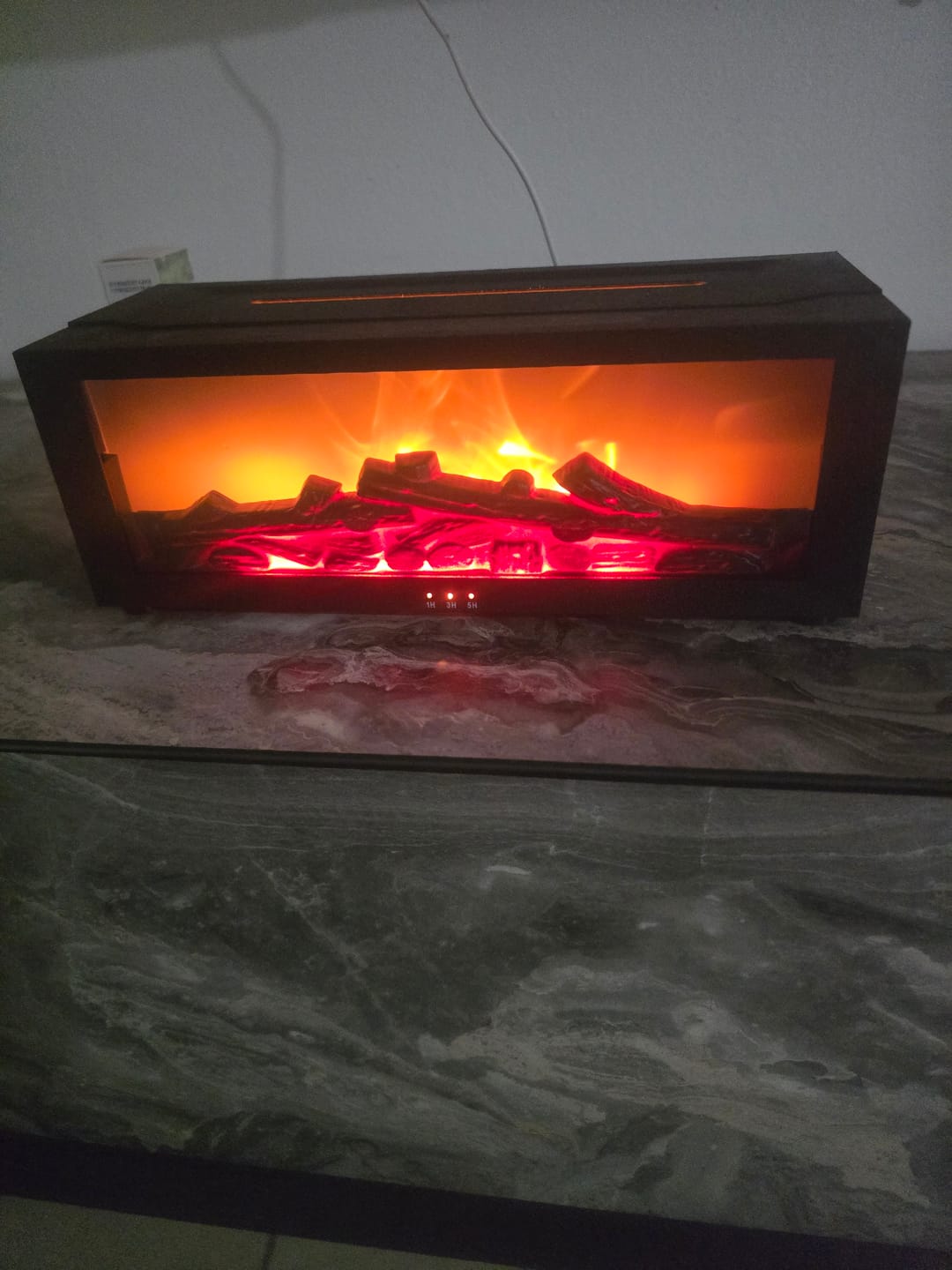 Customer photo review of מפיץ הריח בסגנון קמין + 2 שמנים