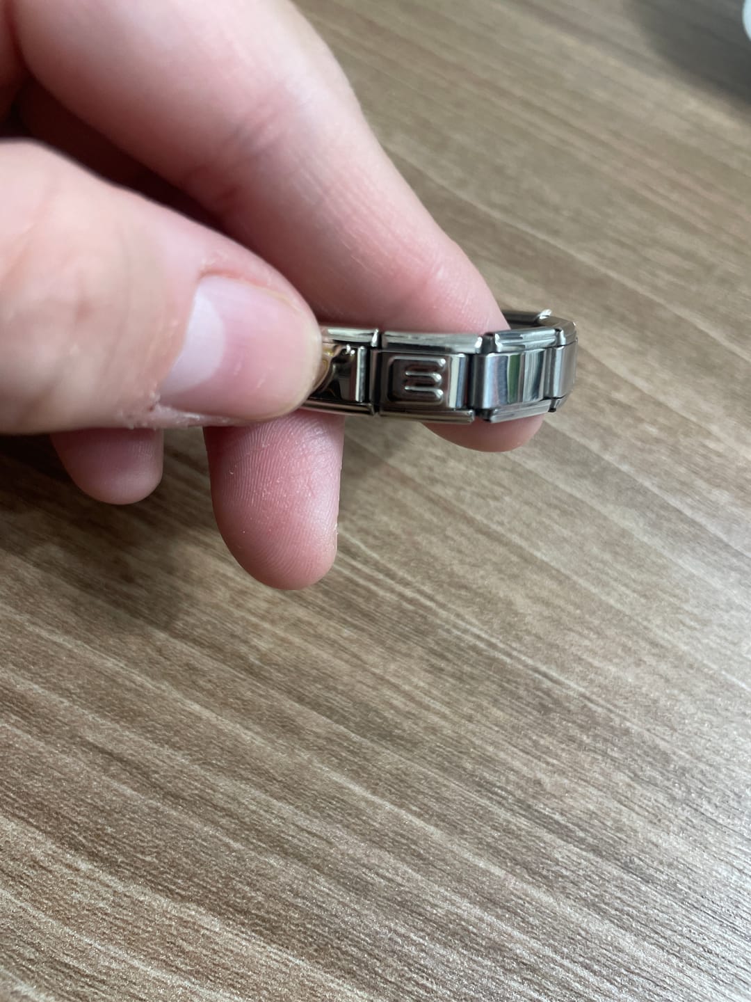 Customer photo review of Charm Inicial Plateada