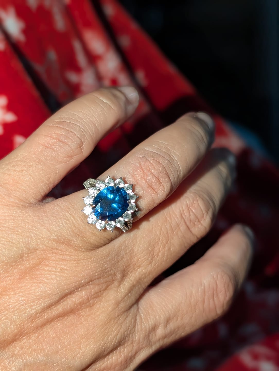Customer photo review of 4.0Ct Halo Oval Cut Blue Stone Split Shank Engagement Ring In Sterling Silver