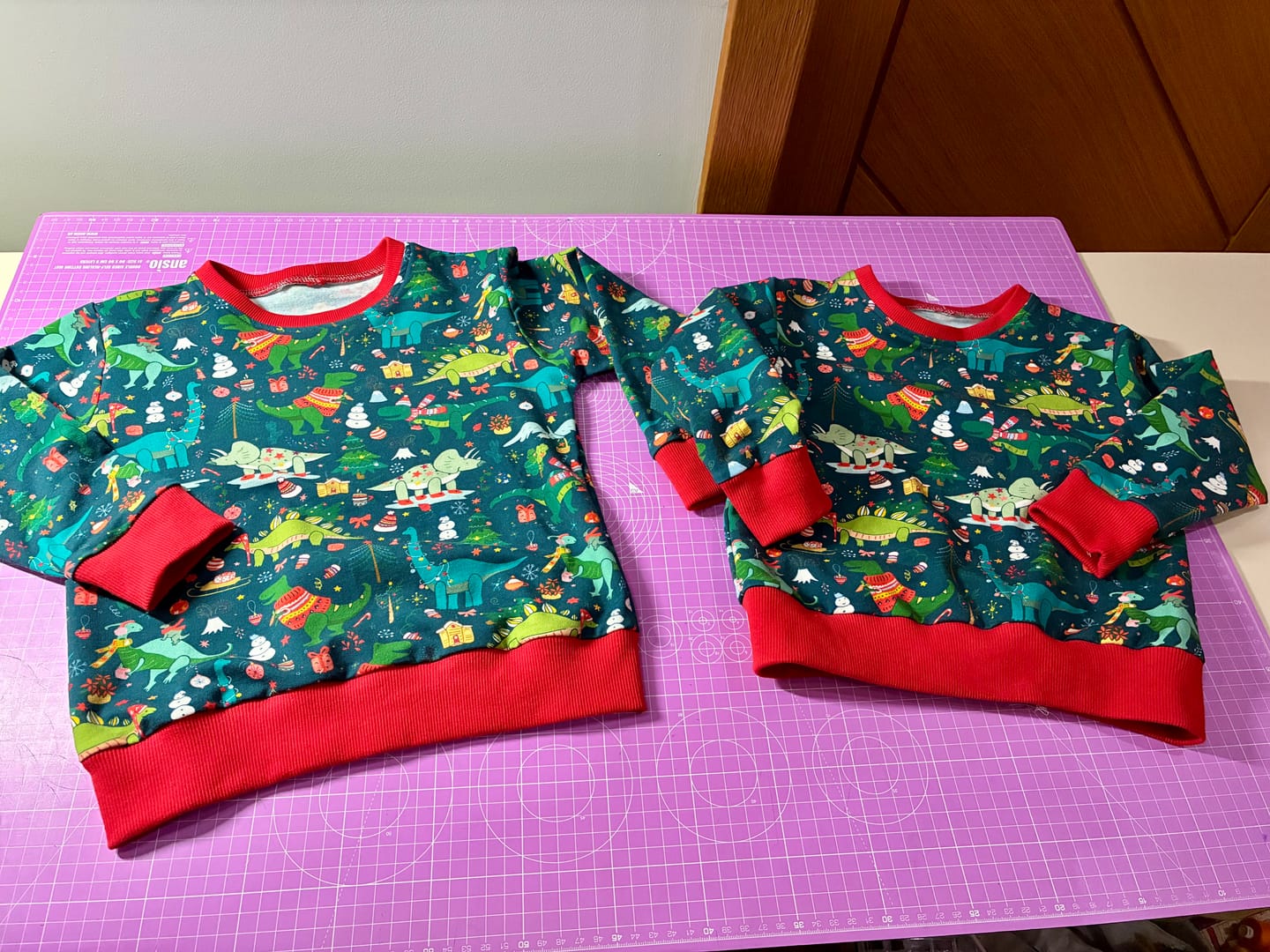Customer photo review of Christmas Dinosaurs on Dark Teal French Terry Fabric