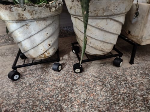 Customer photo review of United Crafts Rozy Wheel Pot Stands for Planters