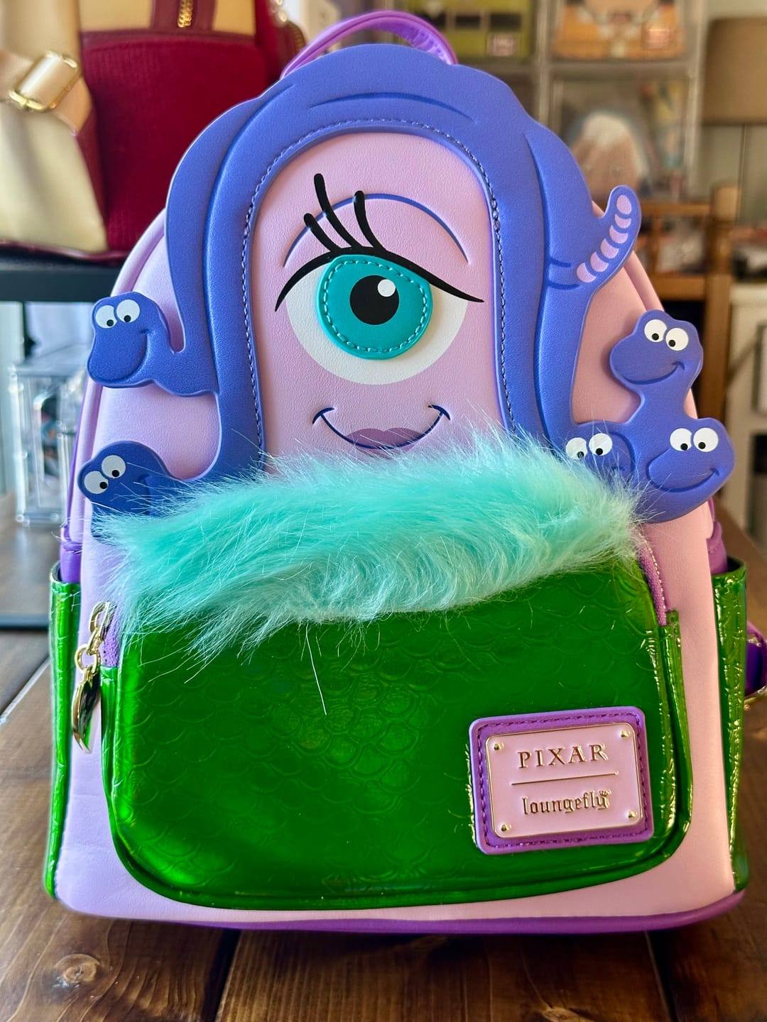 Customer photo review of Loungefly Pixar's Monsters Inc. Celia Cosplay Mini Backpack