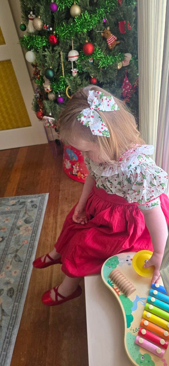 Customer photo review of Holly Jolly Handsmocked Dress