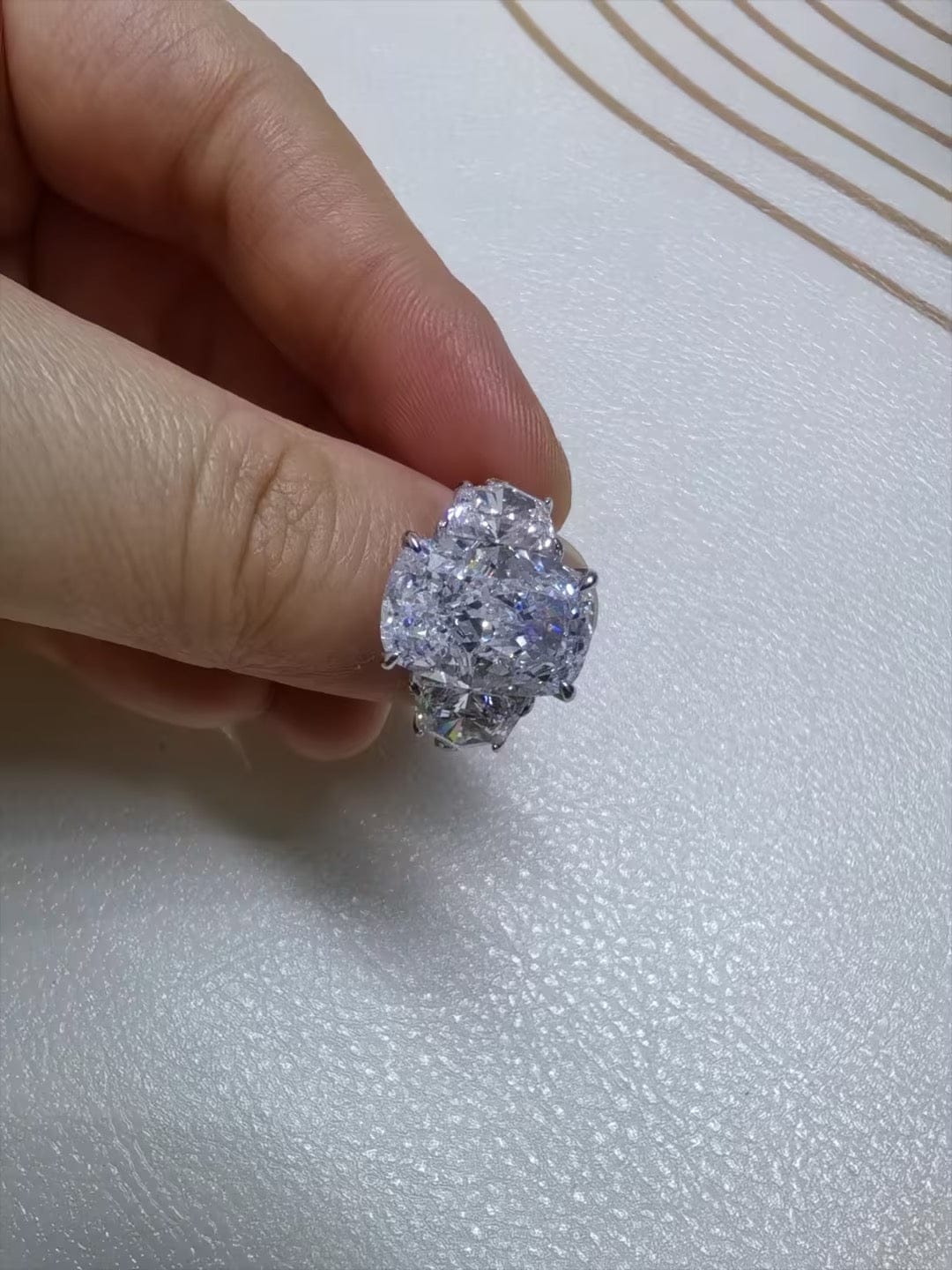 Customer photo review of 6.0 Ct Elongated Cushion Cut Simulated Diamond Three-Stone Travel Engagement Ring in S925 Sterling Silver