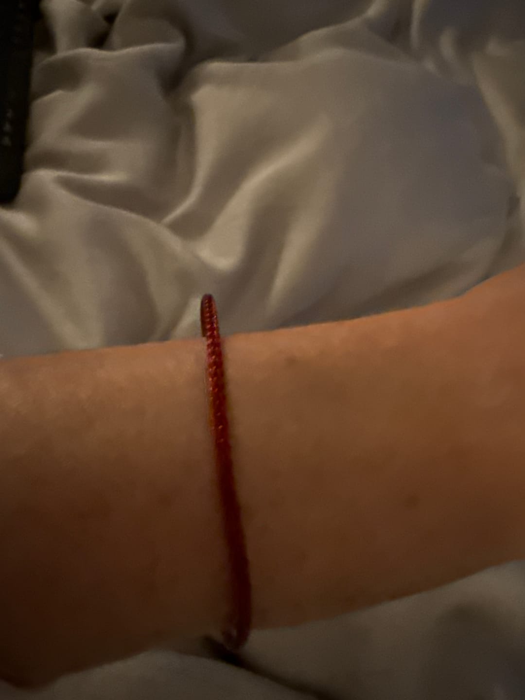 Customer photo review of Protective Red Cord Silver Bracelet