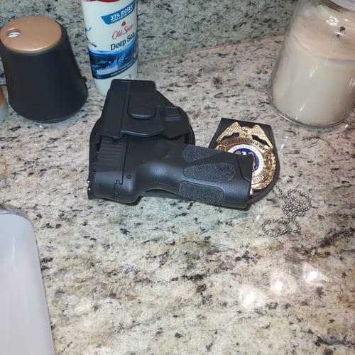 Customer photo review of US Department of Defense Special Agent Badge Solid Copper Replica Movie Props With Number 212