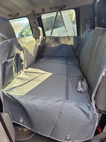 Customer photo review of NEW Waterproof Hard Bottom Car & Truck Seat Foldable Hammock Cover With Storage Pockets, Side Flaps, Headrest Straps, Seat Anchors, & Mesh Window (+FREE SAFETY BELT!)