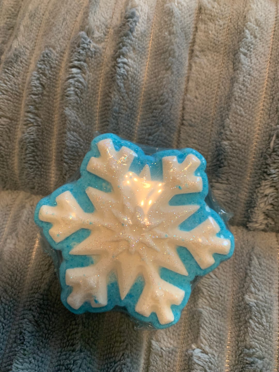 Customer photo review of Snowflake Kids Bath Bomb with Rubber Snowman Figure Inside