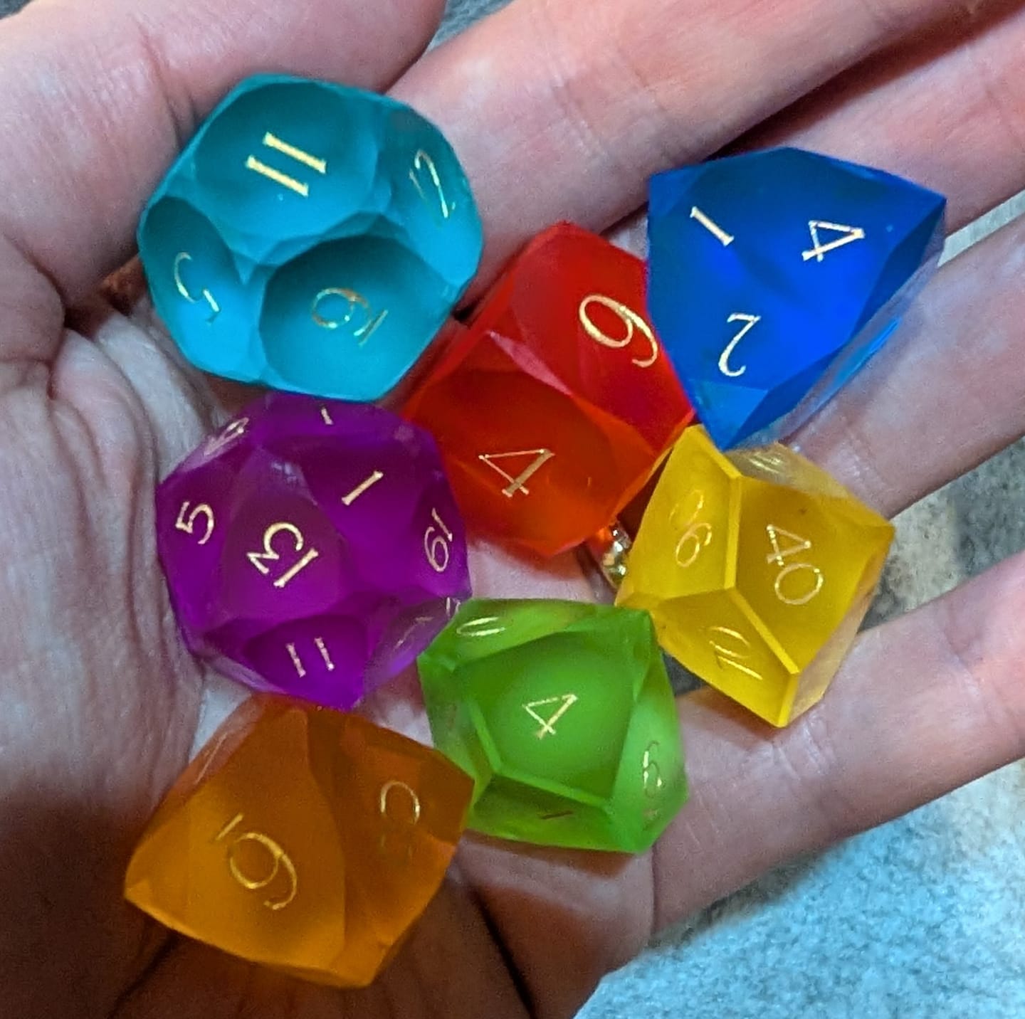 Customer photo review of URWizards D&D Resin Rainbow Candy Engraved Dice Set Multi-faceted Style
