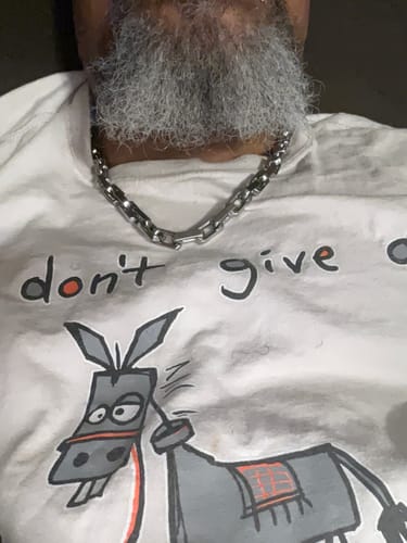 Customer photo review of In The Fight-Never Surrender Necklace - Helps Pair Veterans With A Service Dog Or Shelter Dog