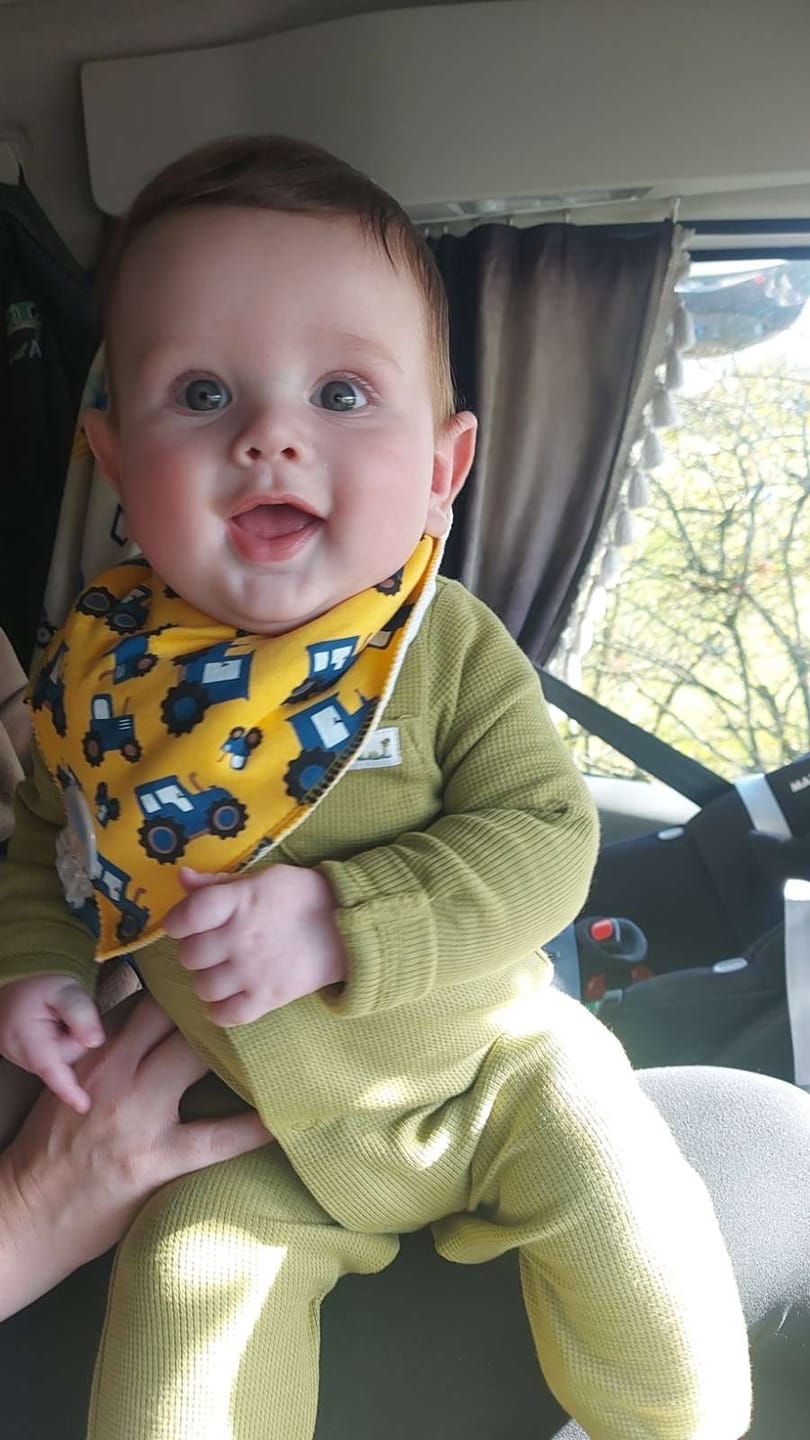 Customer photo review of Yellow Timmy the tractor organic cotton DribbleBoo bandana bib
