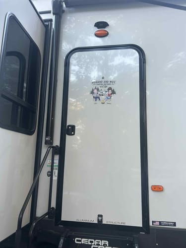 Customer photo review of Camping Partners For Life Doll Couple Sitting Personalized RV Decal