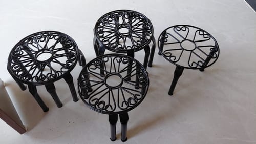Customer photo review of UnitedCrafts Trivia Metal Pot Stand High Quality & Unique Design