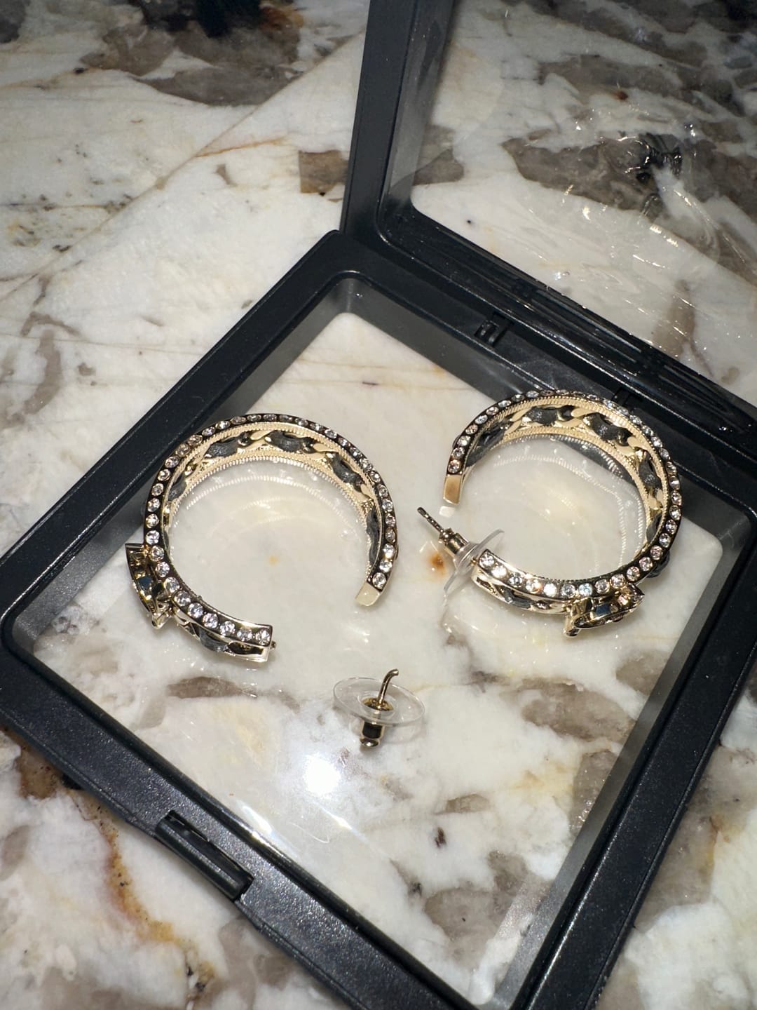 Customer photo review of DOUBLE C GOLD LEATHER CURVED HOOK STUD EARRINGS