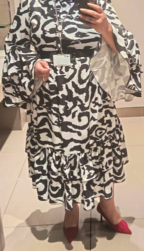 Eva M. review of Ruffle Twisted Elegant Hem High-neck Design Dress. image 1 out of 1