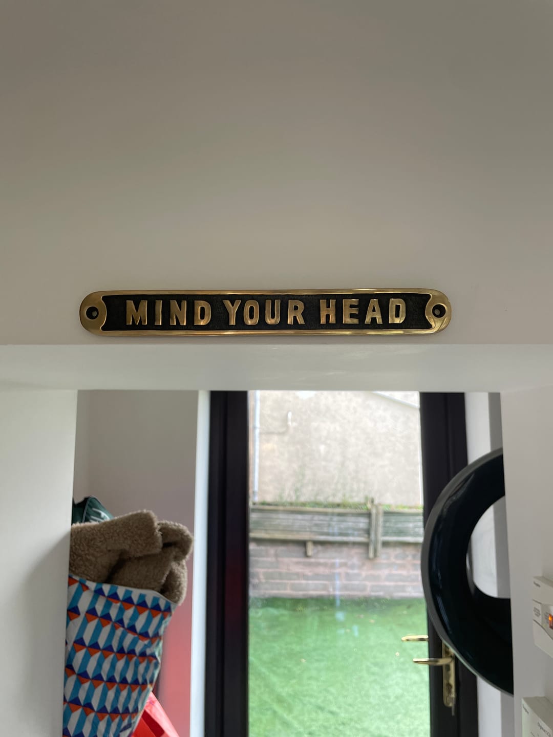 Customer photo review of Mind Your Head Sign · Brass ·