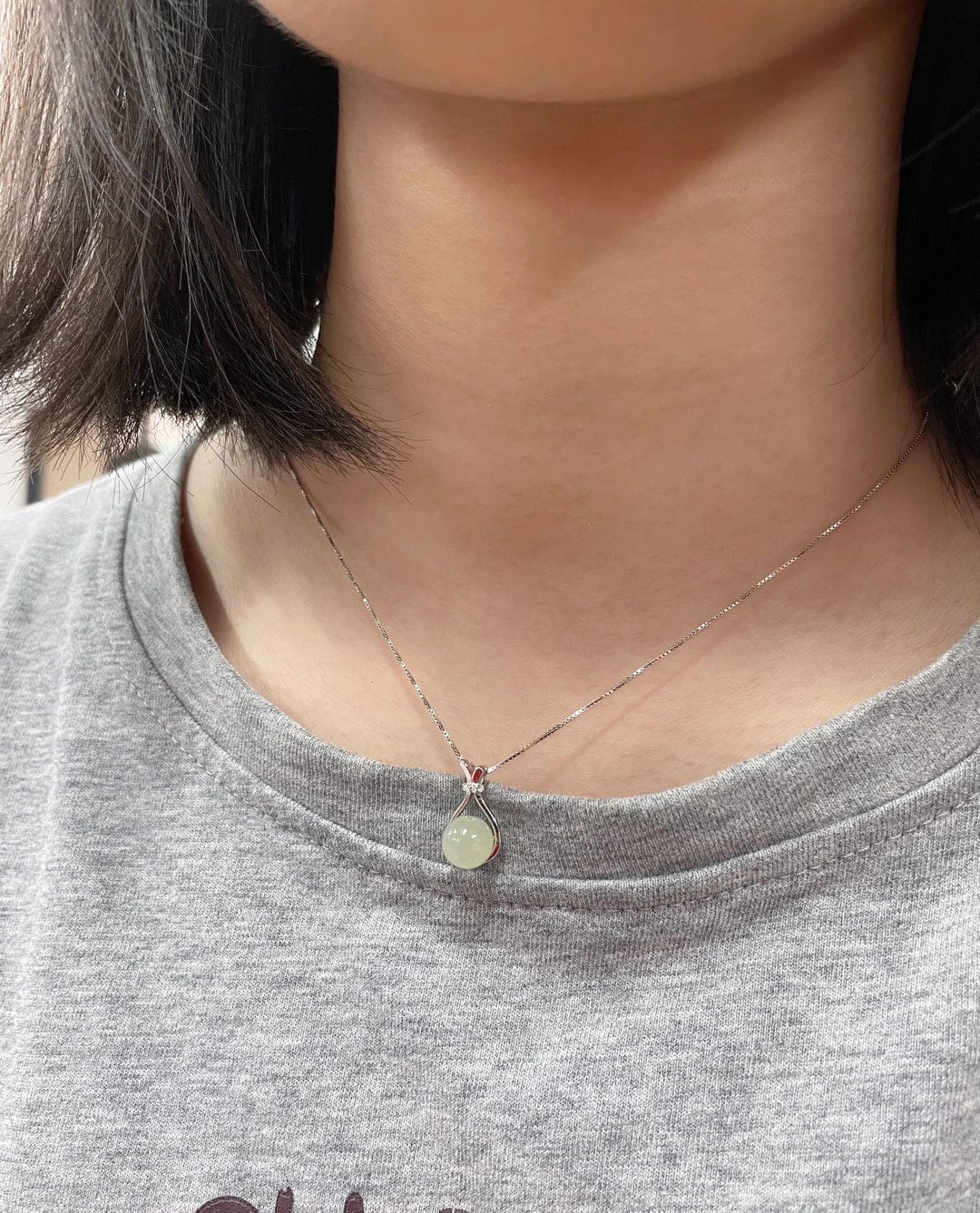 Customer photo review of Jade Fortune Pouch Necklace